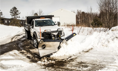 snow plow truck plowing snow